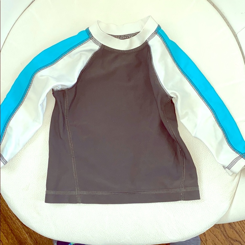 6-9 month grey white and blue rash guard